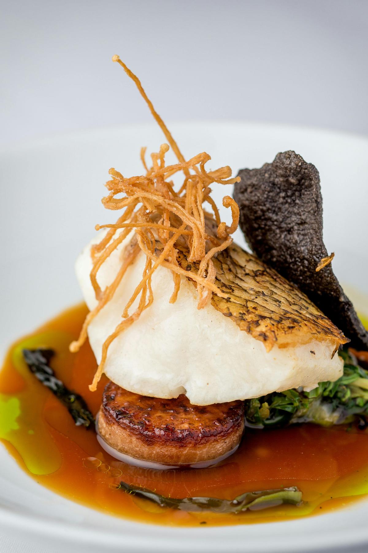 Glacier 51 Toothfish, shitake suimono, black rice wafer, dill, daikon, enoki crisp, gai lum