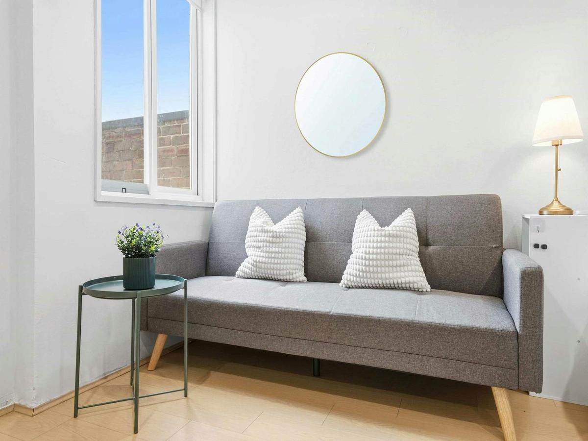 Comfortable sofa that converts into a sofa bed, providing flexible sleeping arrangements.