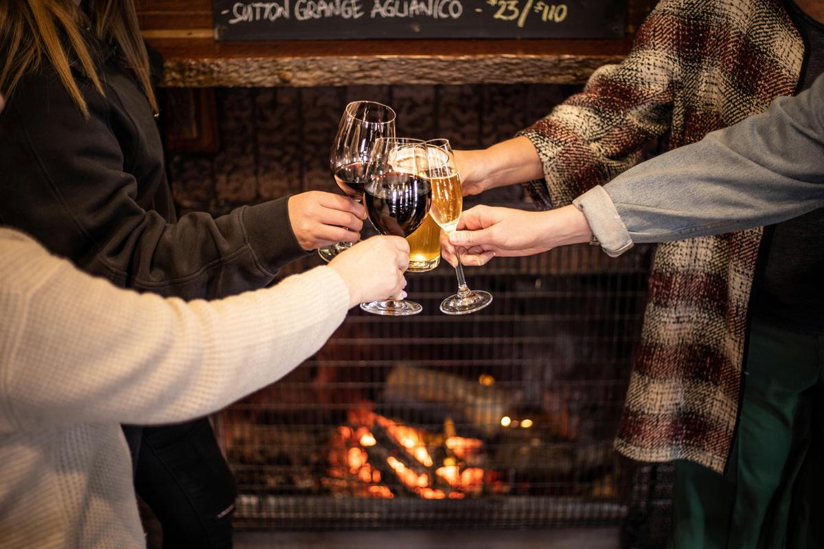 Drinks in front of the public bar fireplace.