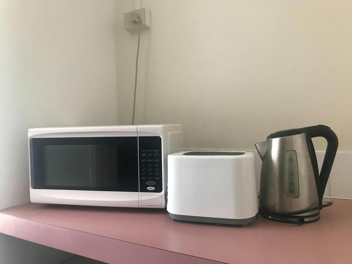 Room facilities - Microwave, Kettle, Toaster, Bar fridge, Plates & Cutlery