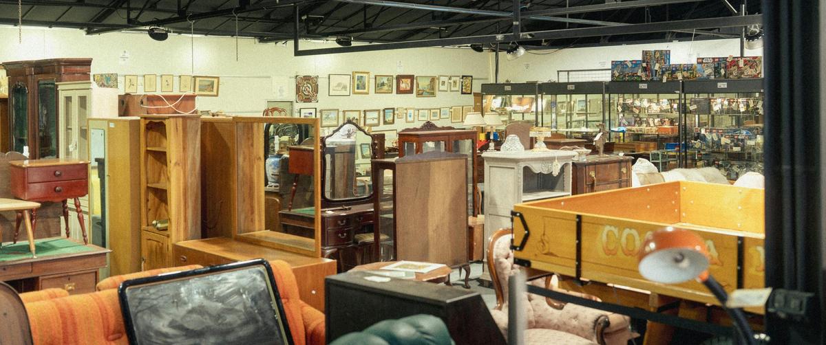 Shot of the inside of the EHVA showroom showing a selection of antique furniture and art