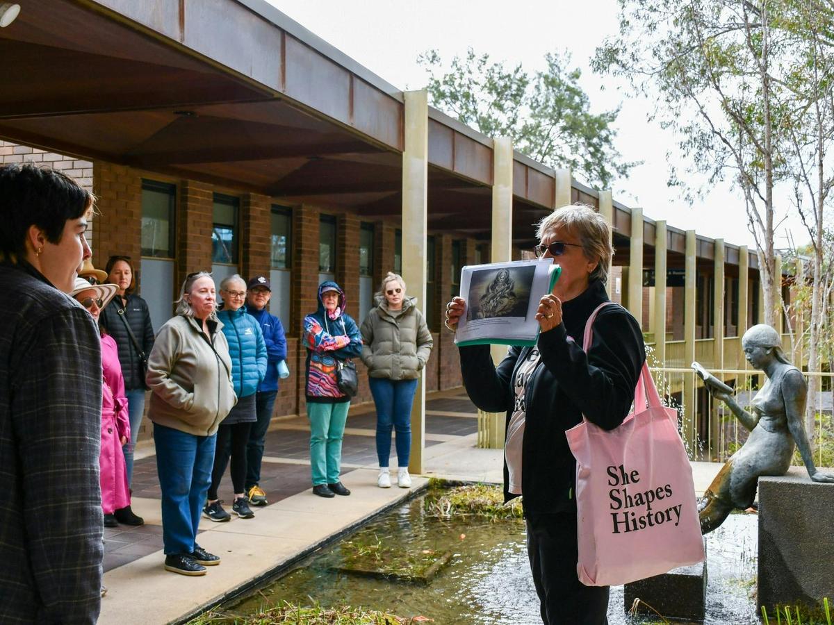 Local guide in Canberra walking with group