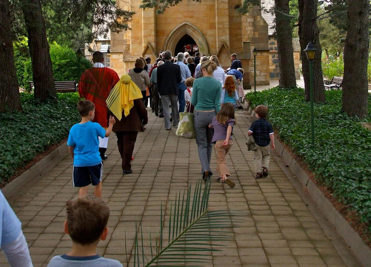 Families entering Canberra's oldest church