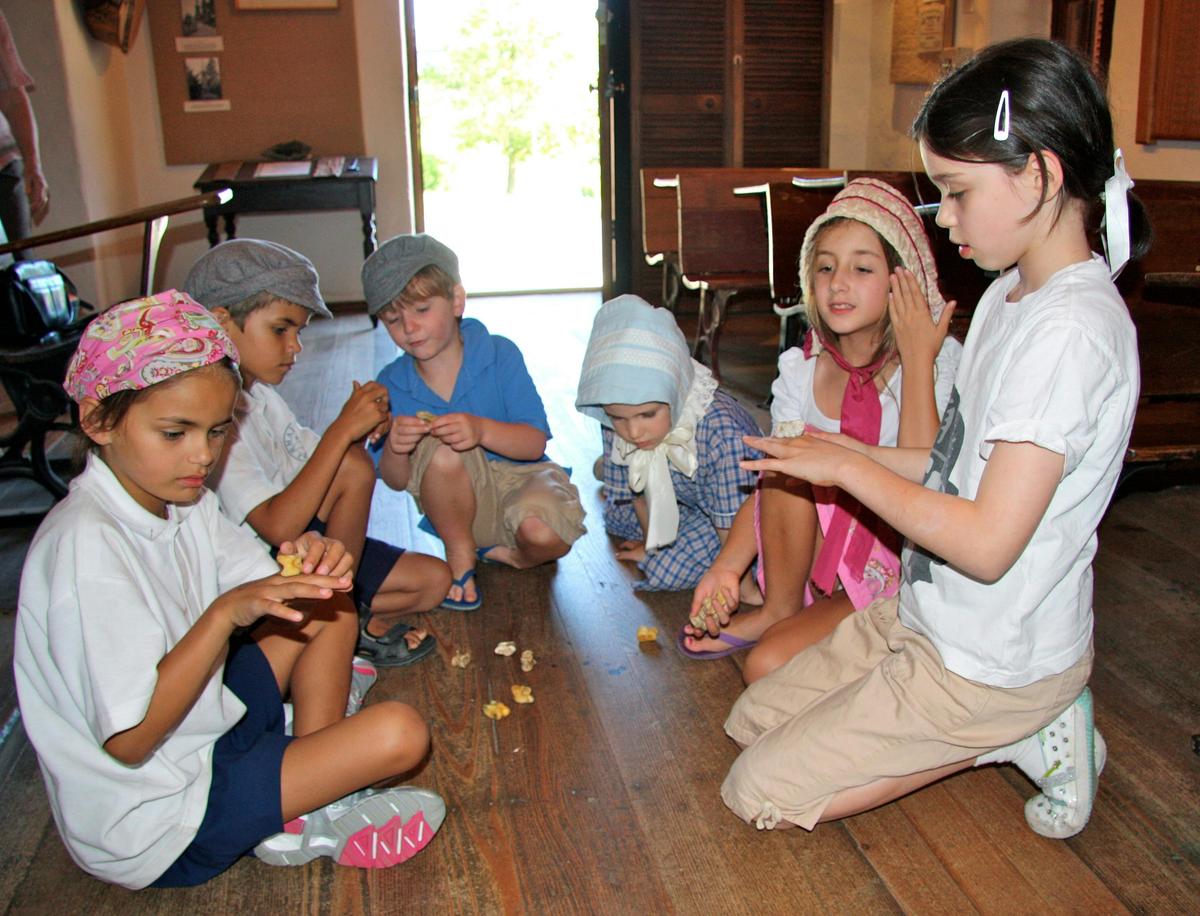 Children like to play the old simple games, like knucklebones