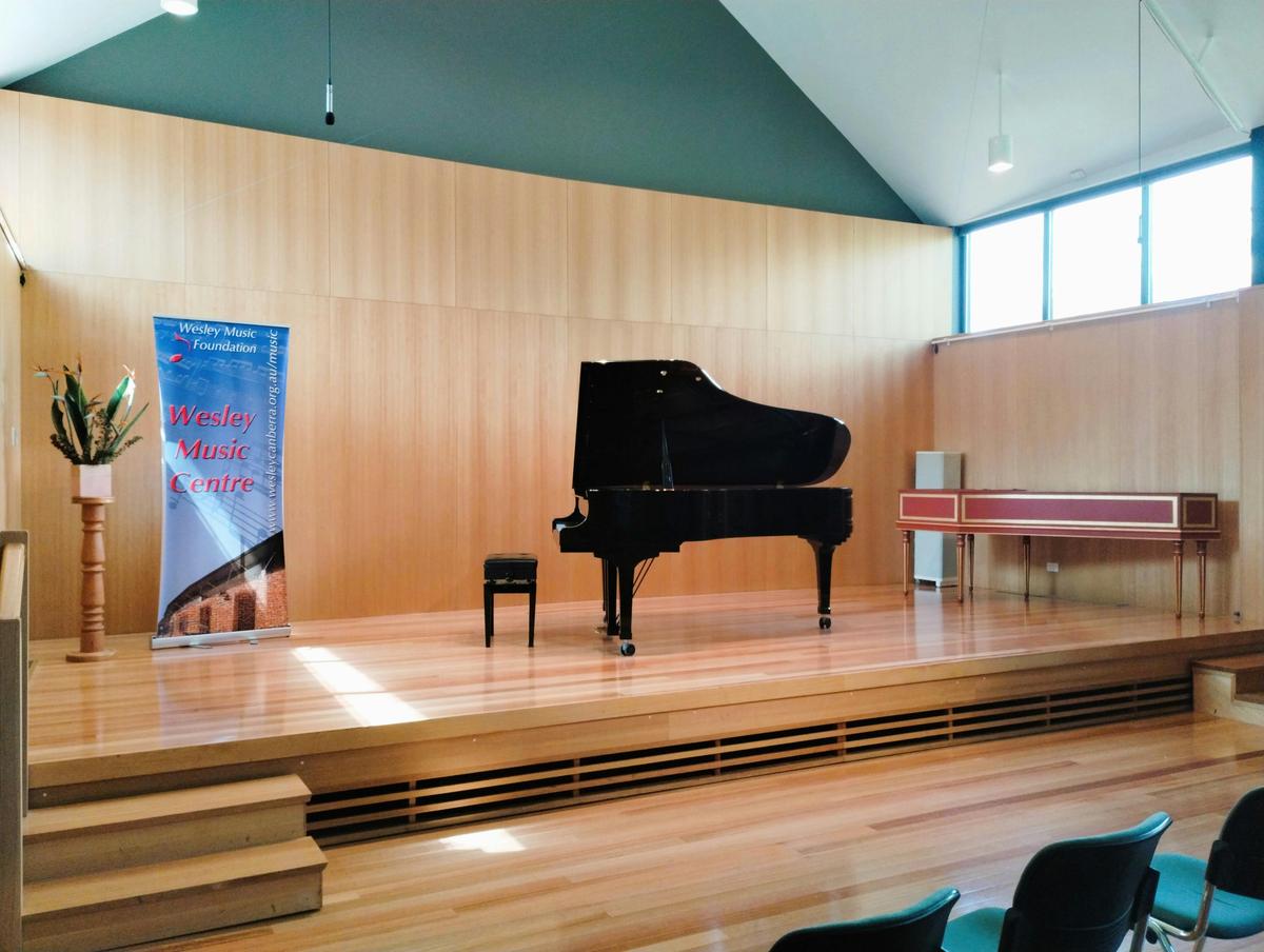 Stage of Mansfield Room with Yamaha Grand Piano and Harpsichord