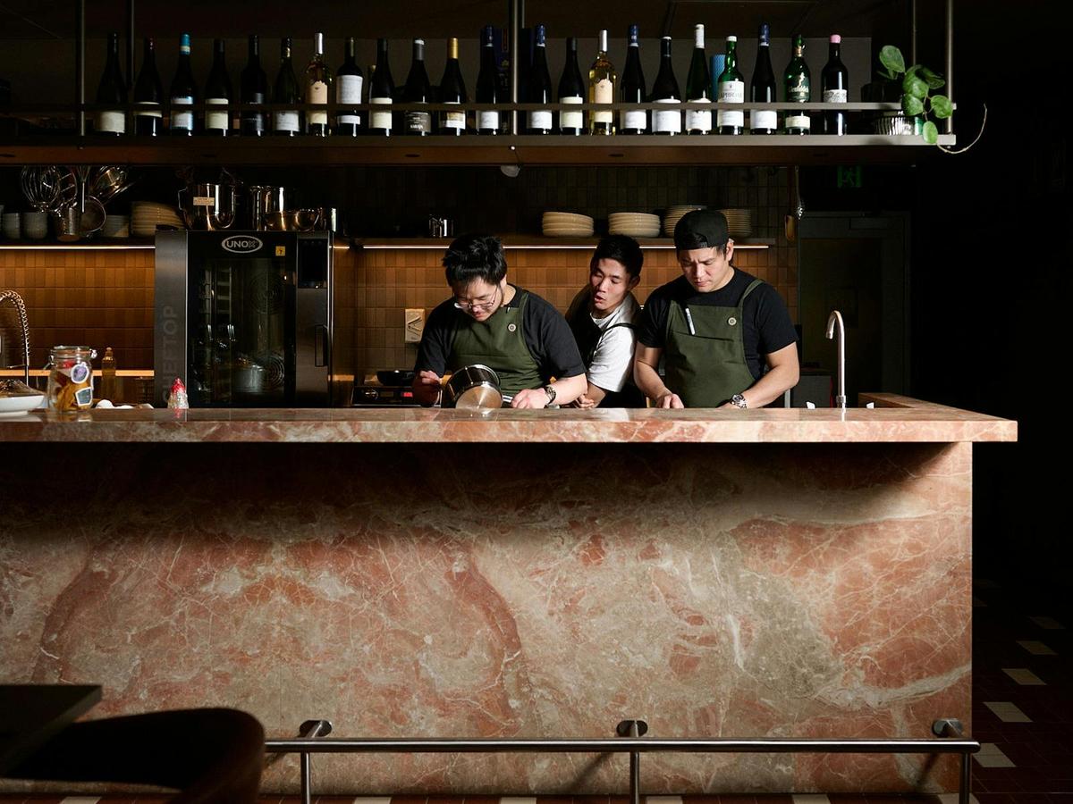 Sitting at the kitchen bar is the best way to experience the magic.