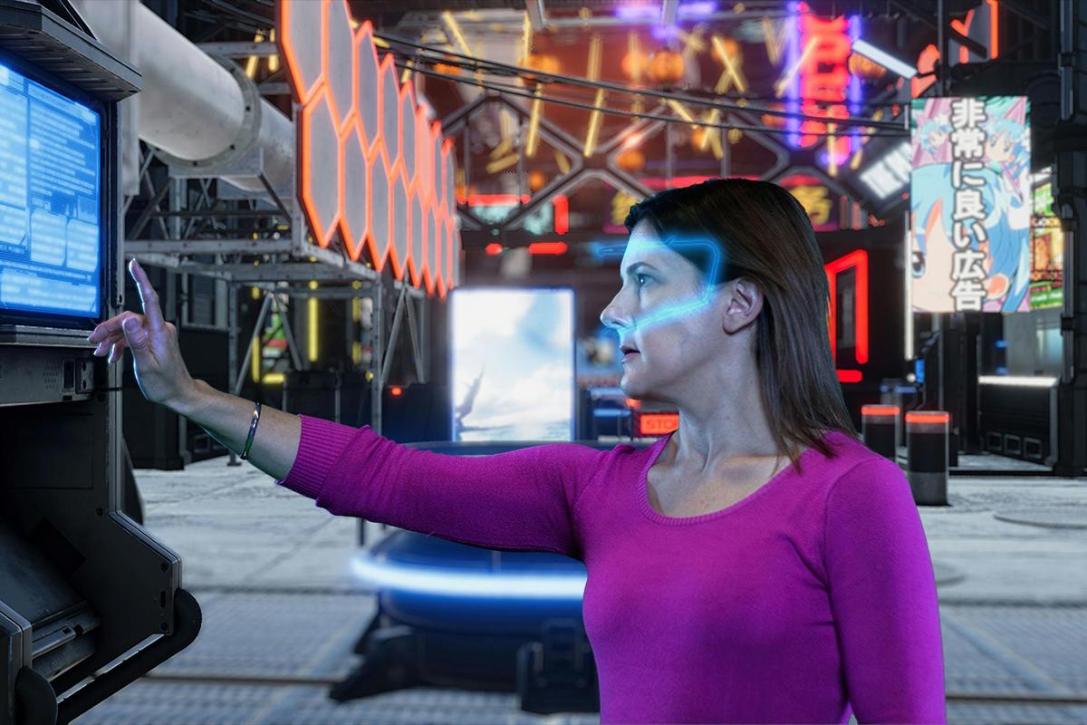 Lady with a glowing VR headset using a digital screen in an escape room