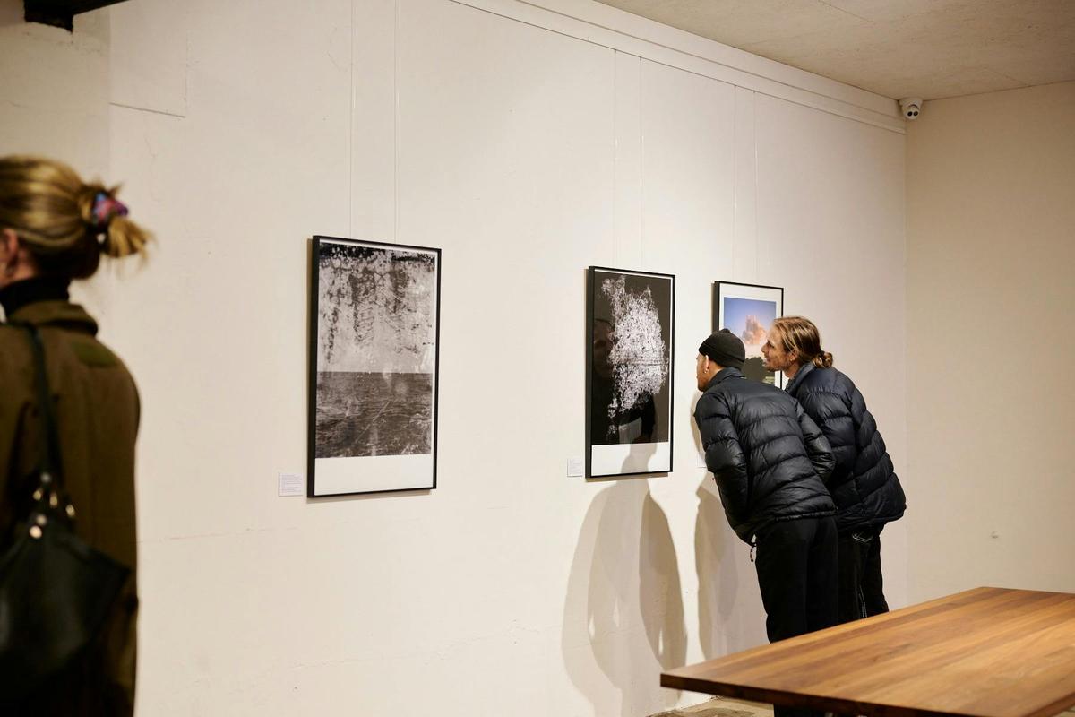 Visitors looking at work by Sammy Hawker