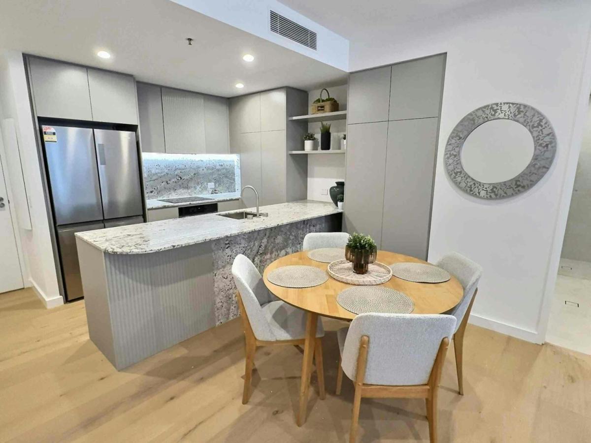 Cook and dine at home with a fully functional kitchen counter and dining setup.