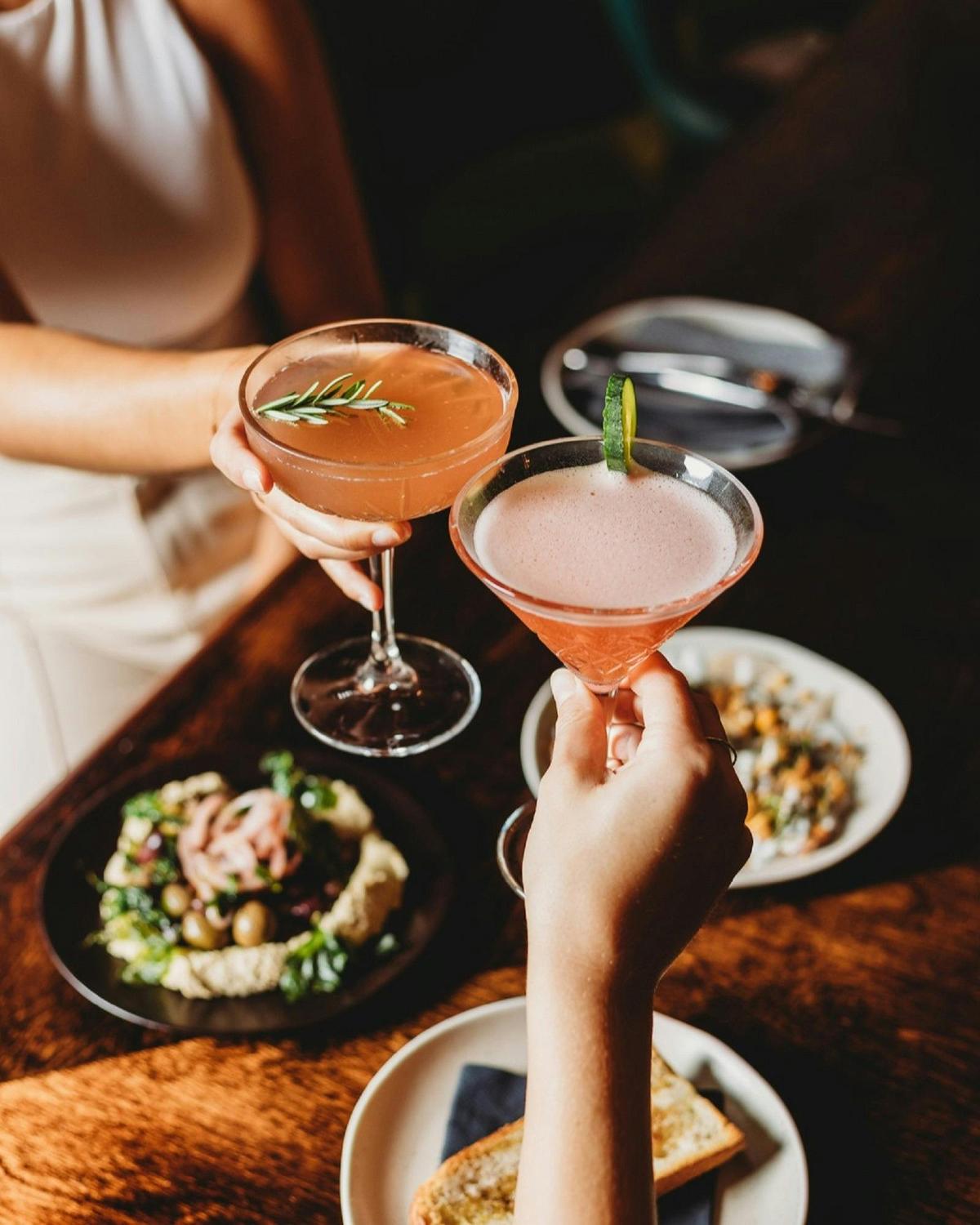 Cocktail drinks being clinked