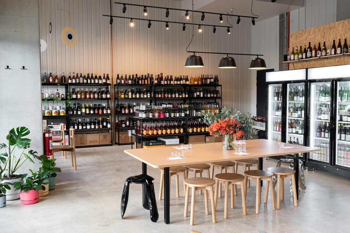 Store layout of Paranormal Wines - stools, tables and variety of wines