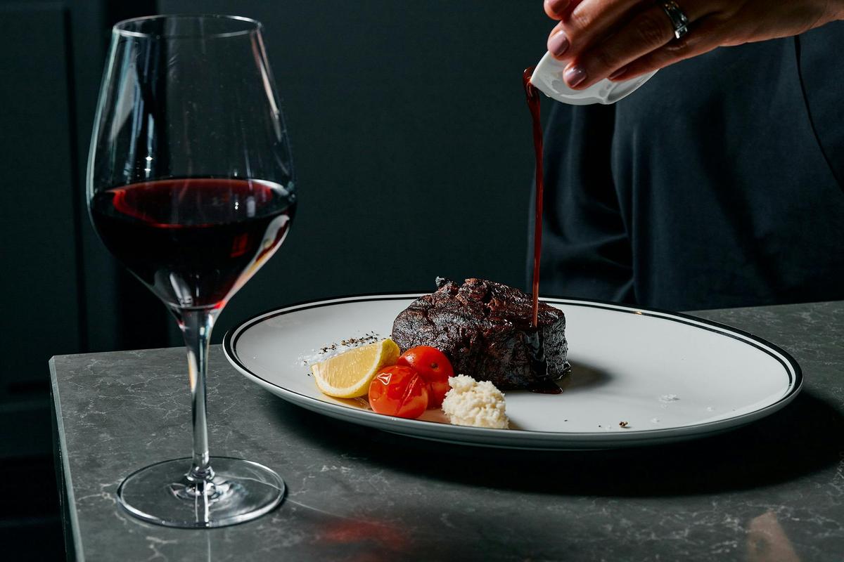 Fire-grilled steak by Gamekeepers, paired with your favourite premium pour of wine.