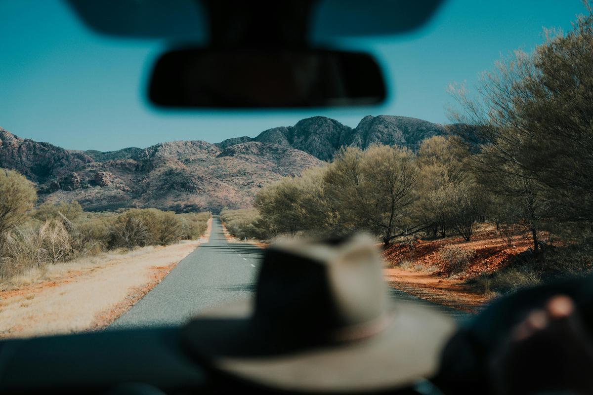 Hat on the dashboard of a car driving through the Red Centre