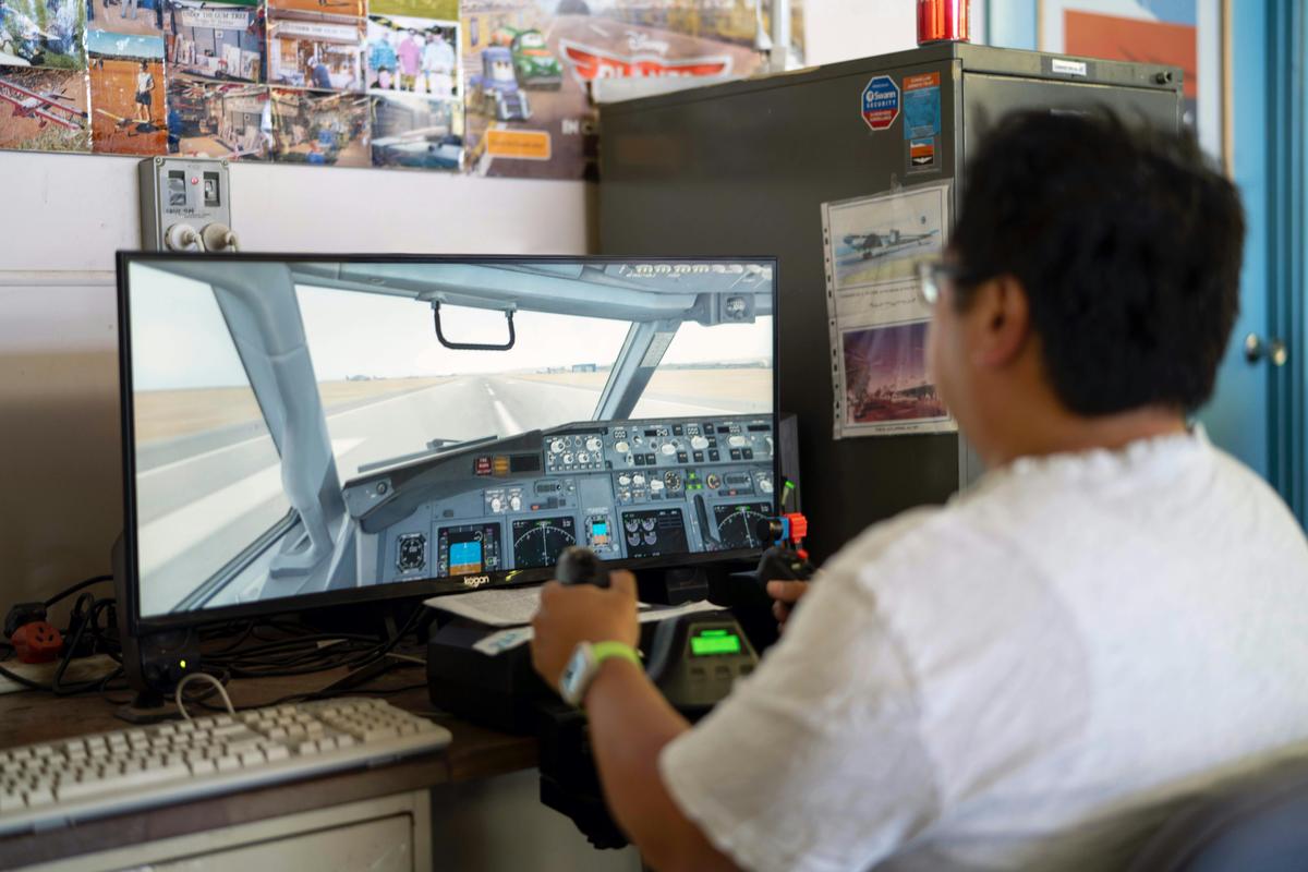 Test your flying skills on the Flight Simulator - volunteers are there to help.