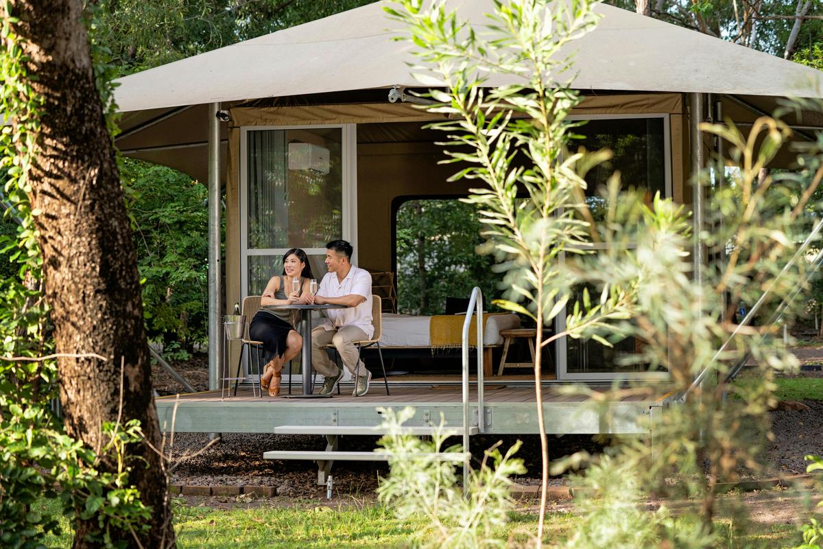 Couple enjoying a drink at Cooinda Lodge Kakadu