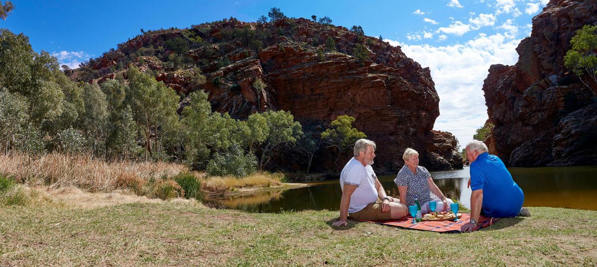 A group having a picnic on the banks of Ellery Creek Big Hole