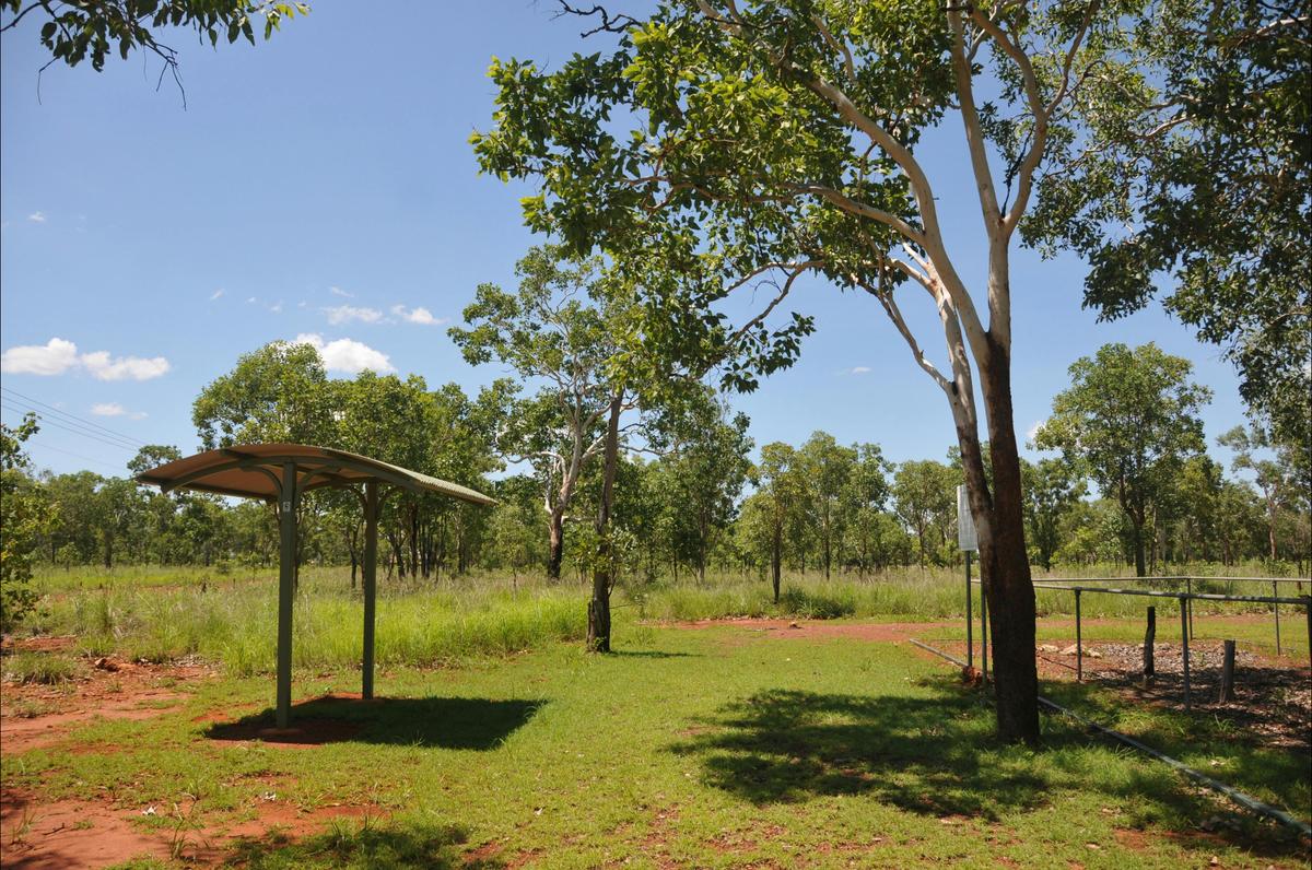 Shelter at the site. The cemetery is on the right.