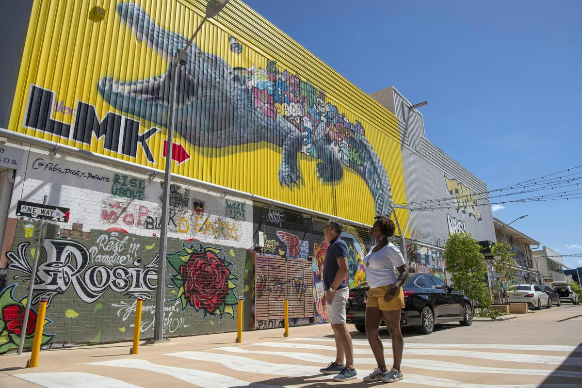 Couple admiring Darwin Street Art