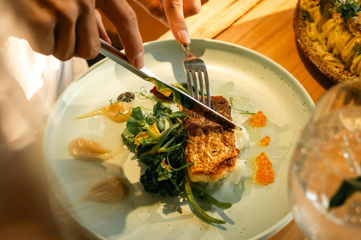 Barramundi, Broccolini and Papaya Salad at Mimi's Restaurant
