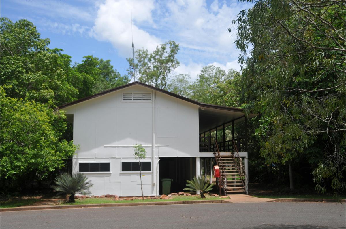 ilding façade with carpark in the foreground.