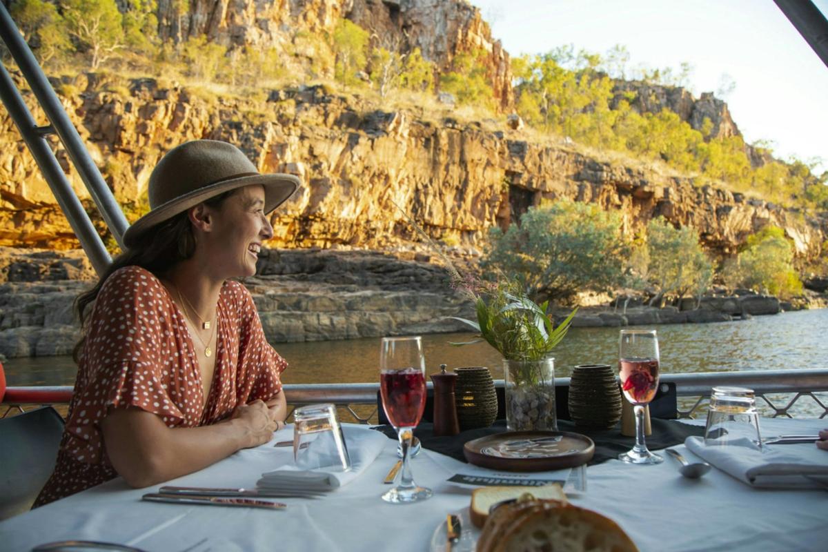 Woman enjoying the Nabilil Dreaming Sunset Cruise on Nitmiluk Gorge