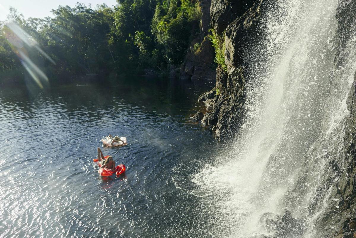 Two girls floating on blow up rings at Wangi Falls