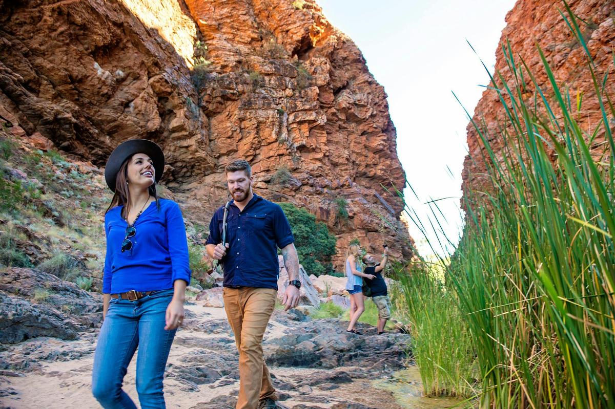 Visitors walking through Simpsons Gap