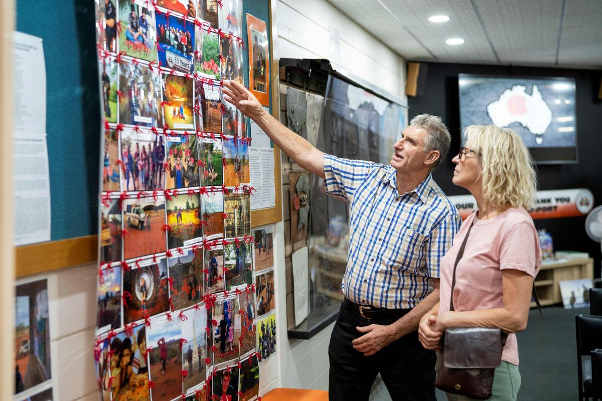 Visitors admiring the historic photos