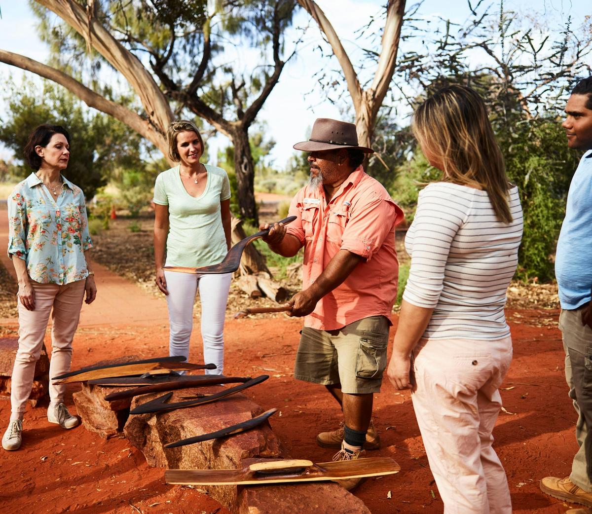 Man Holding tools with audience