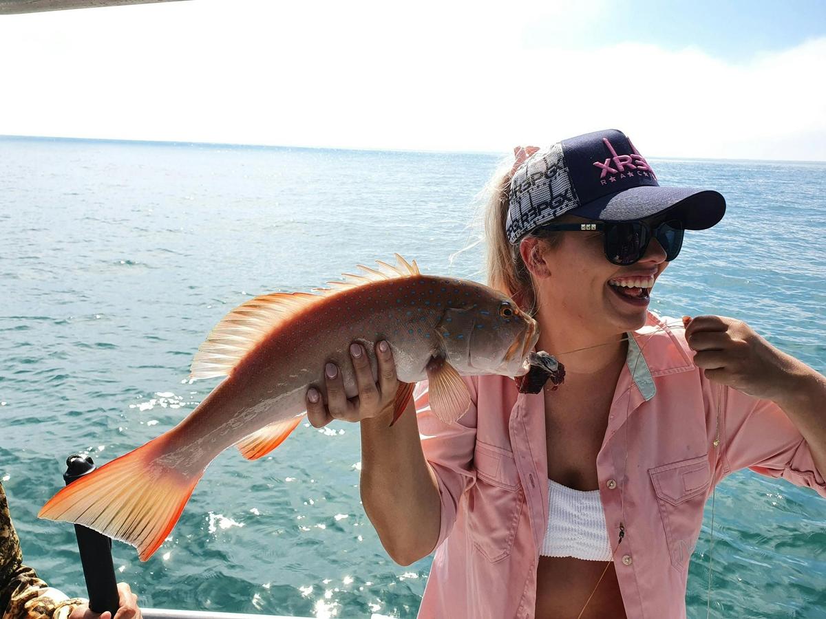The happy face shows the excitement when you catch your first Coral Trout
