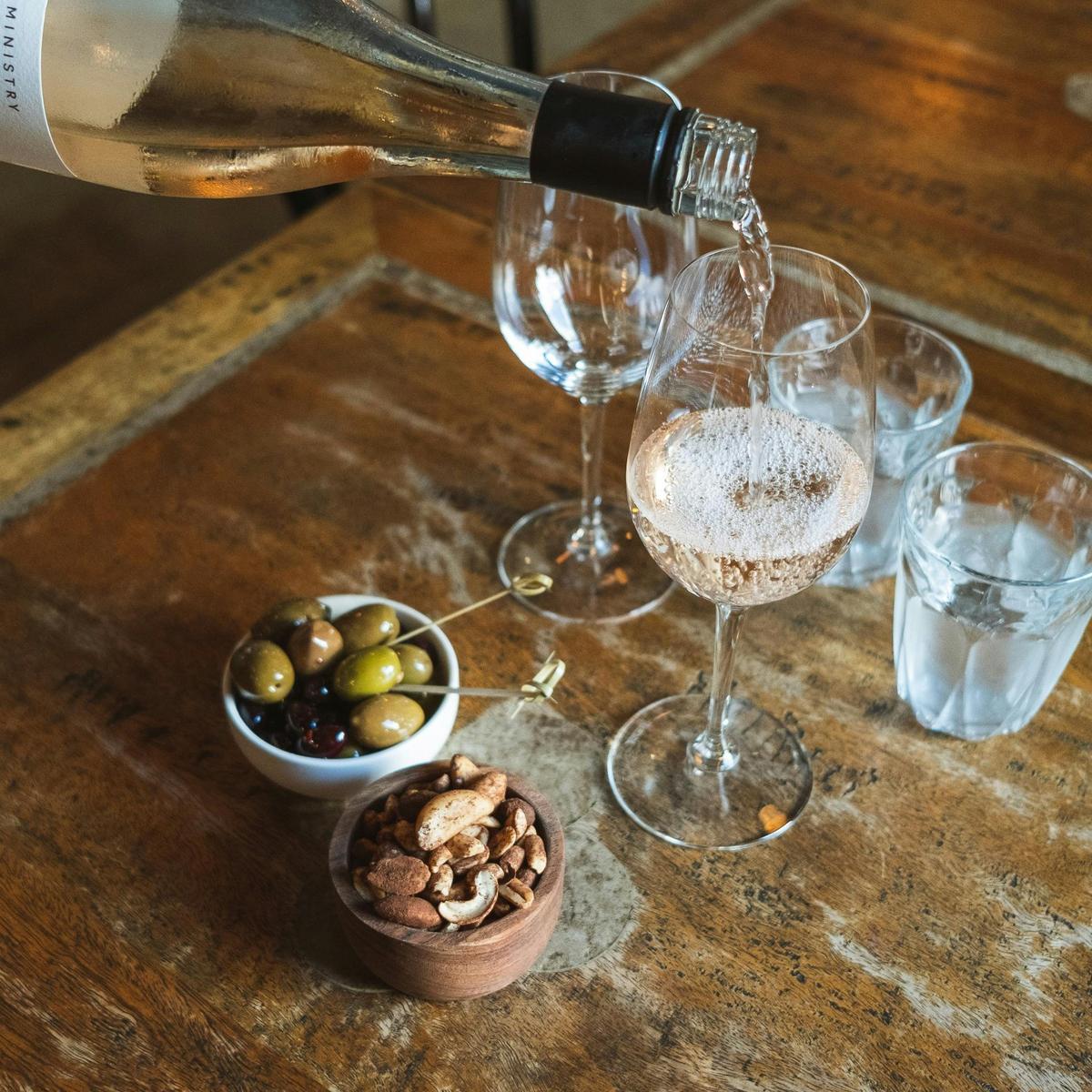Glasses of wine on a table with snacks
