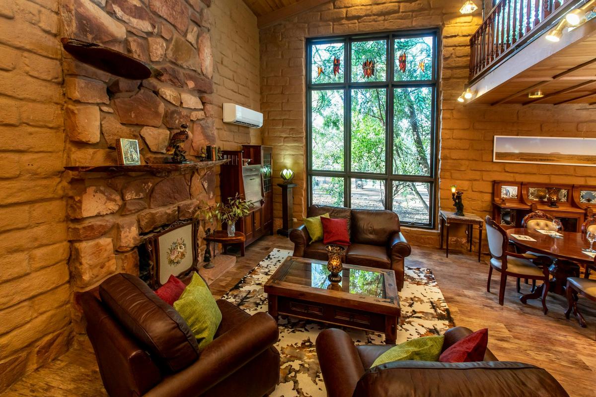 Sturt Desert Pea House - formal lounge and dining with beautiful stained glass windows