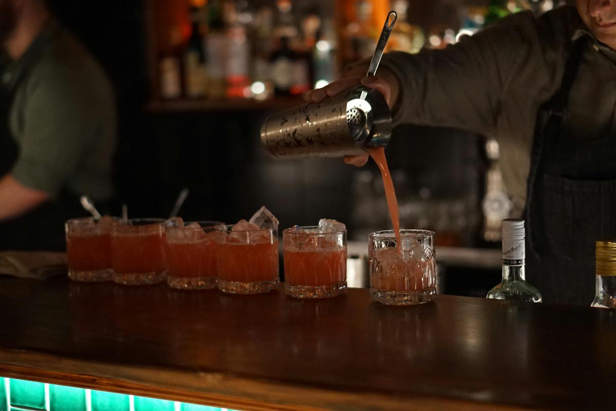 Bartender pouring cocktails