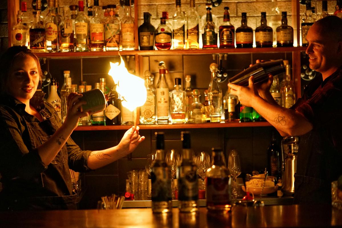 Award winning bartenders, shaking & flaming cocktails