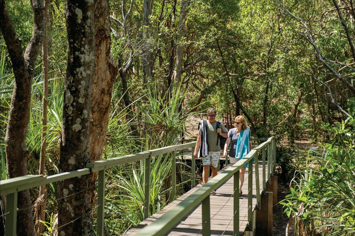 Couple walking together at Wangi Falls