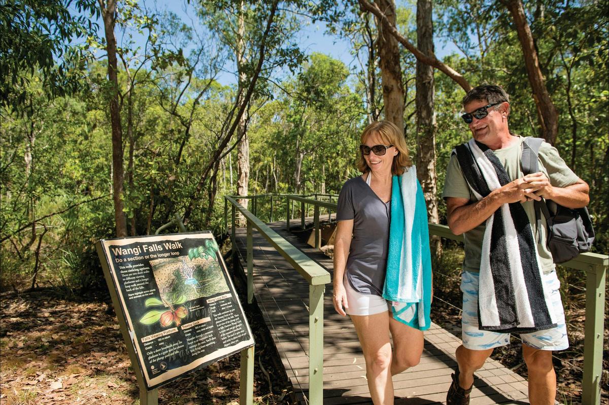 Couple walking together on the Wangi Falls Walk