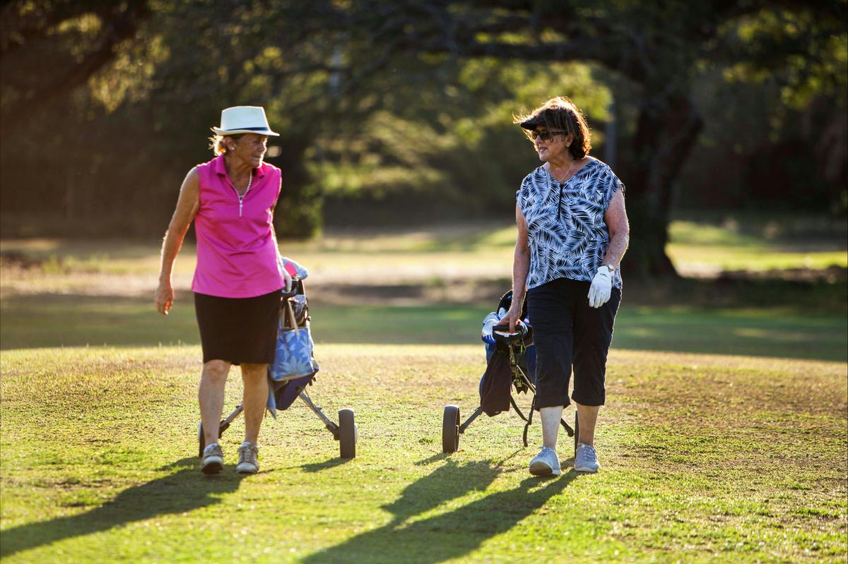 Lovely ladies playing a game at gardens park golf links