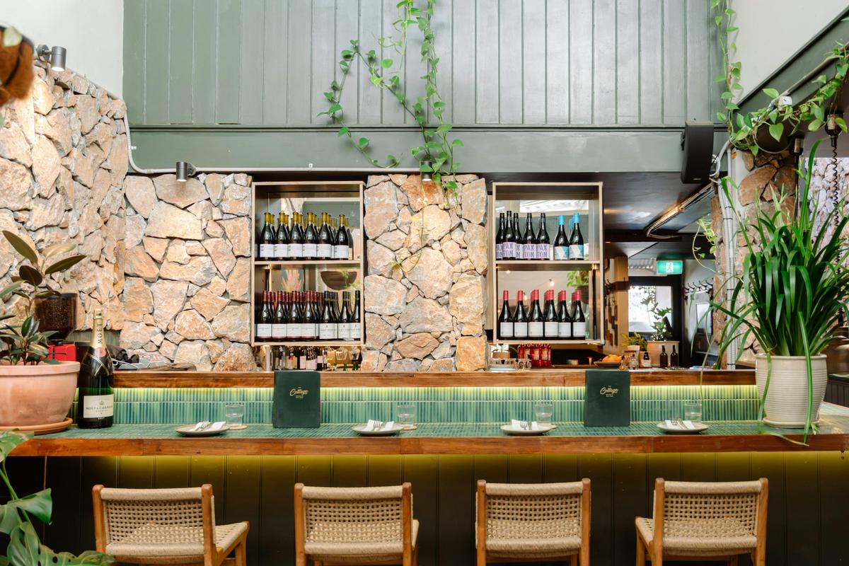 This stunning bar perfectly blends modern rustic charm with botanical vibes.