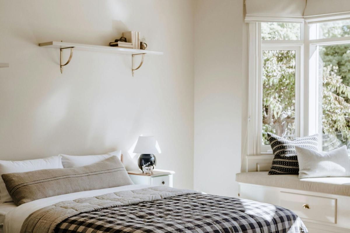 Second bedroom and  a glimpse of the garden view