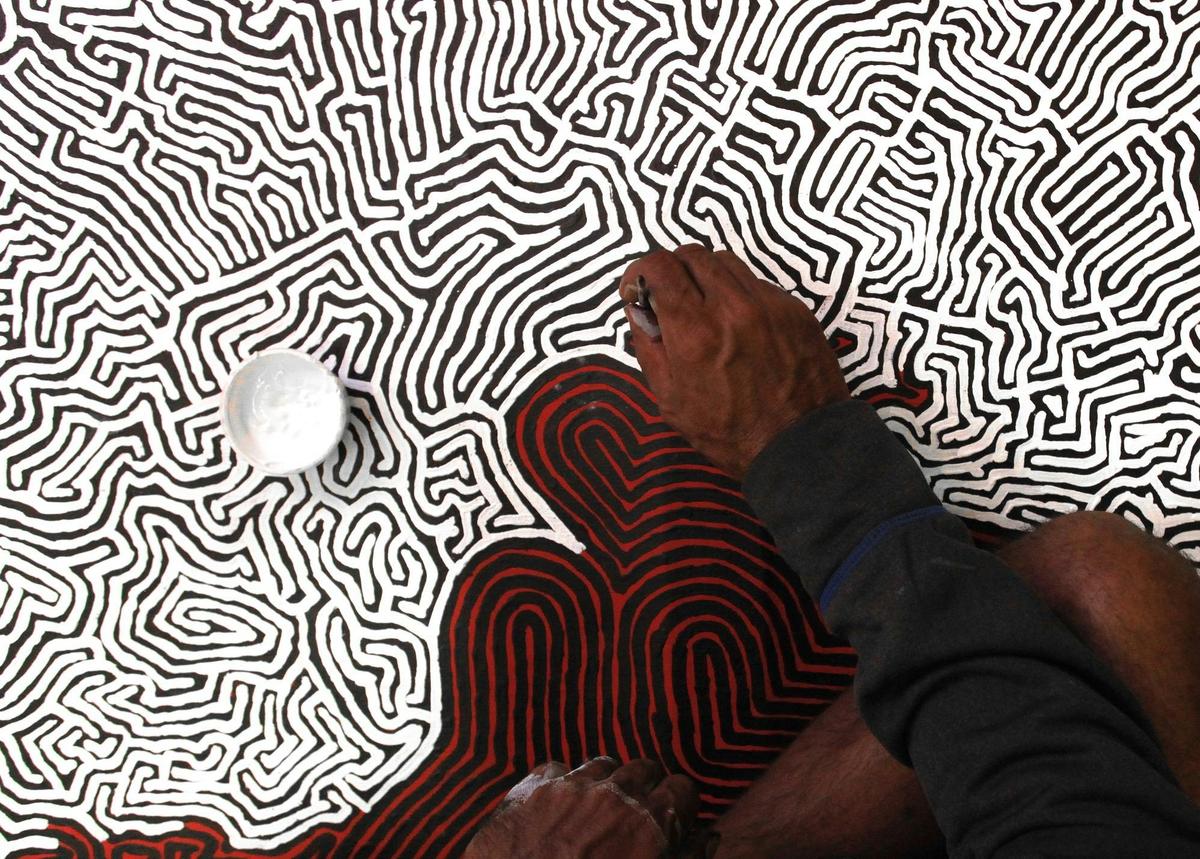 Walter Brown working on his Tingari Cycle artwork