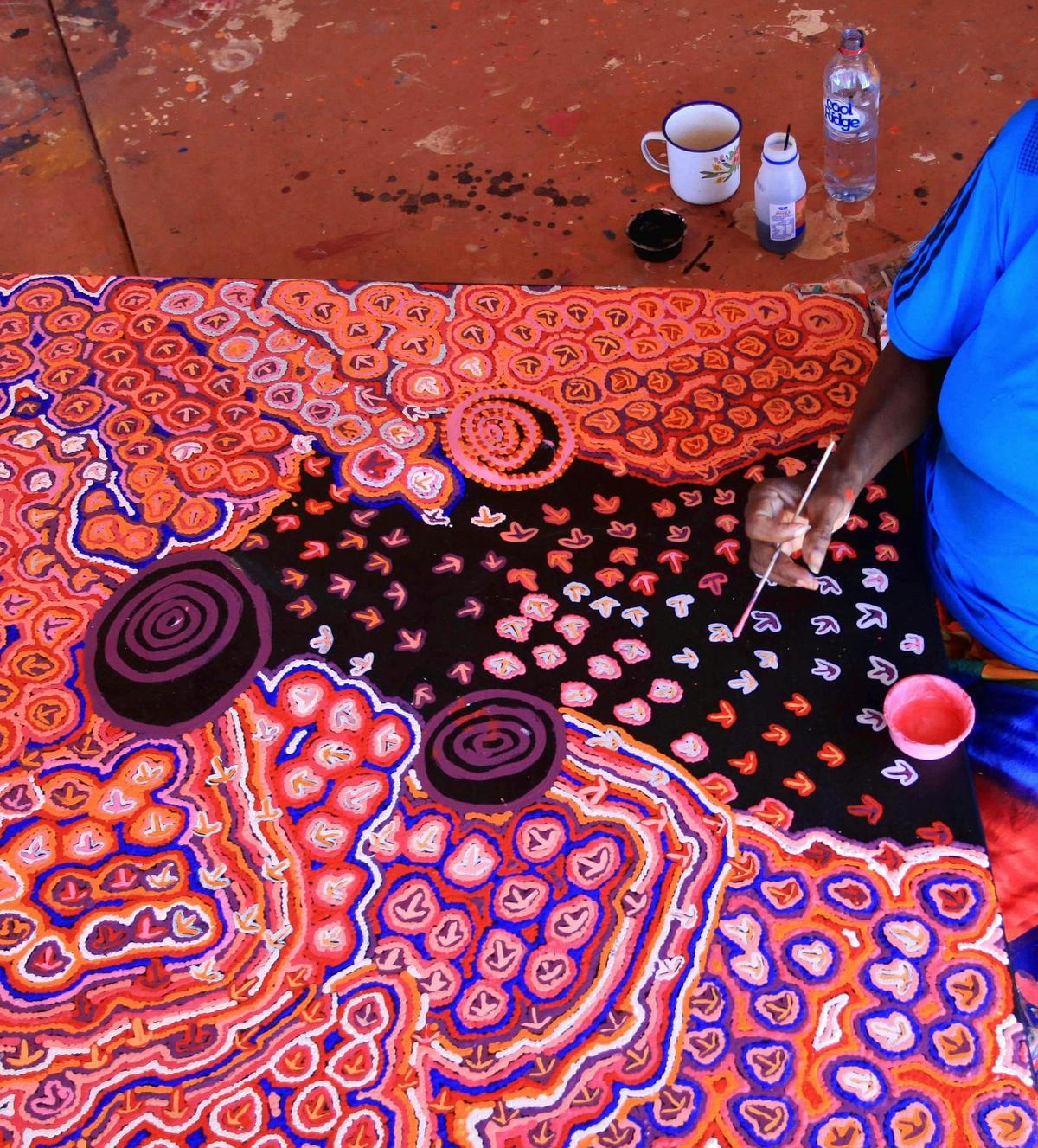Margaret Gallagher working on her Emu Dreaming