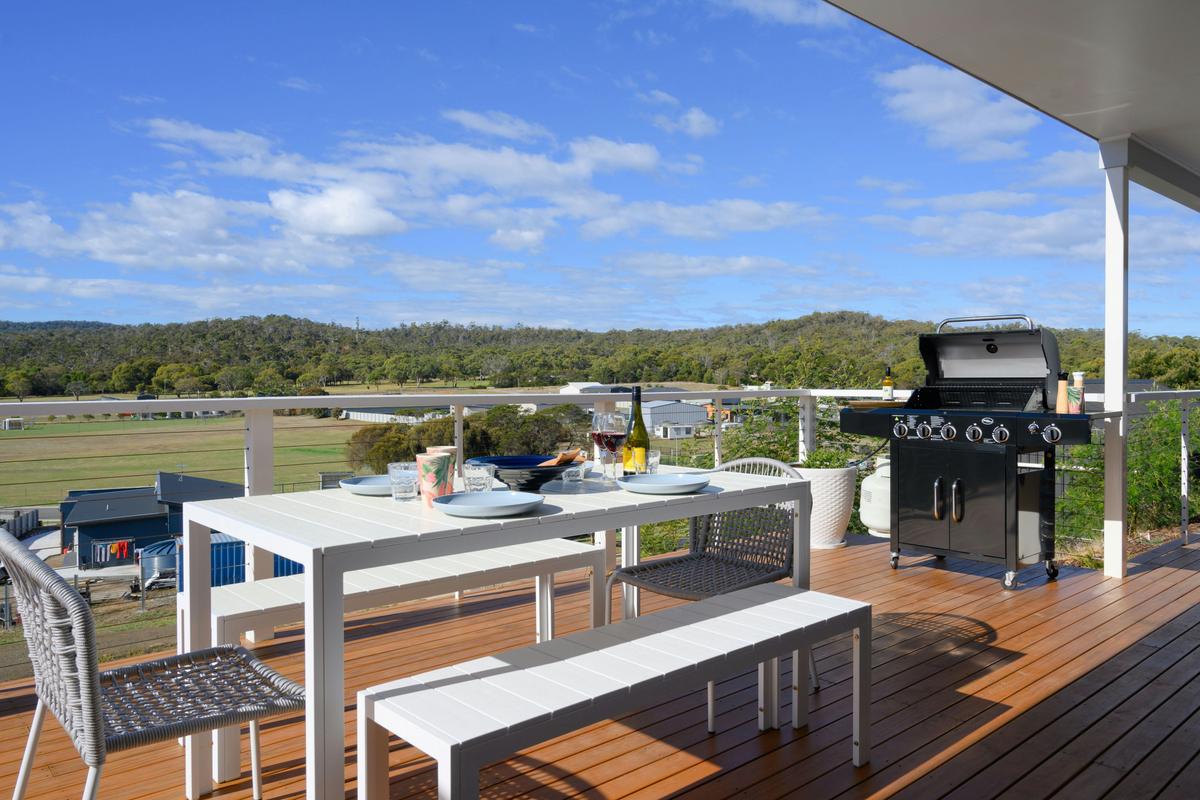 Balcony with outdoor dining and BBQ