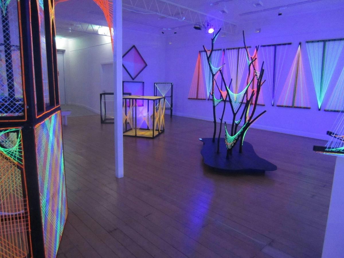 'Strings Attached' black light string art exhibition by Leigh Arnold and Christine Spedding
