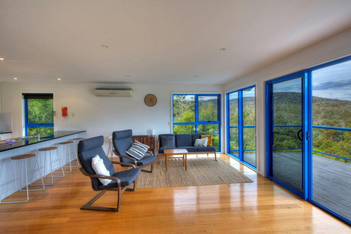 Beautiful timber floor boards and floor to ceiling windows