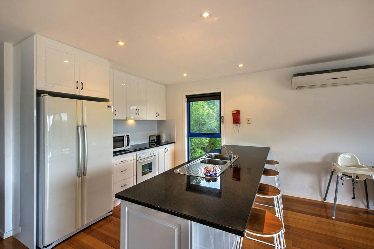 A well equipped open plan kitchen with views