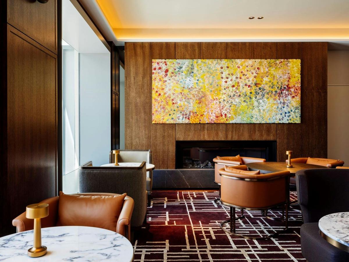 Deco Lounge with tables set near fireplace