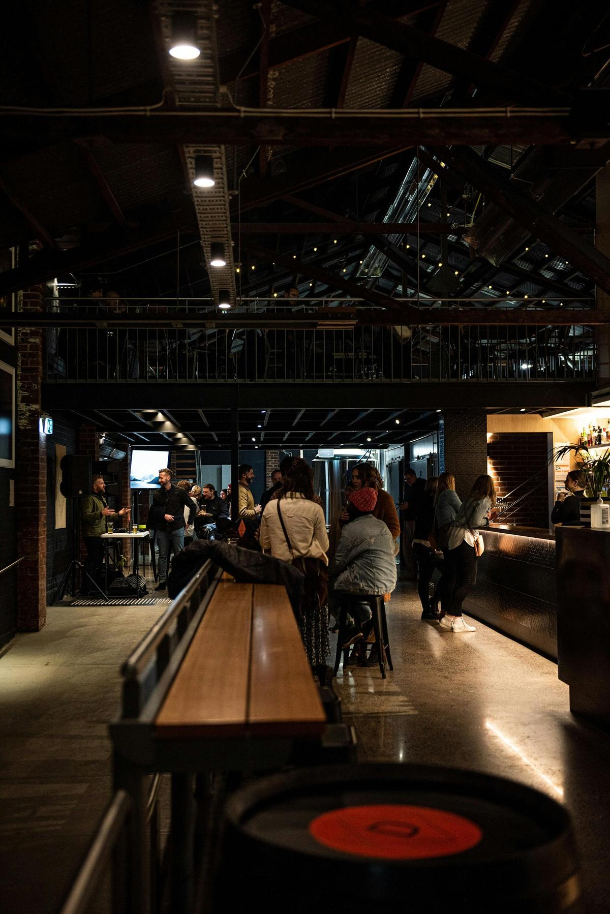 A shot of the downstairs bar area through to the brewery with a mezzanine above