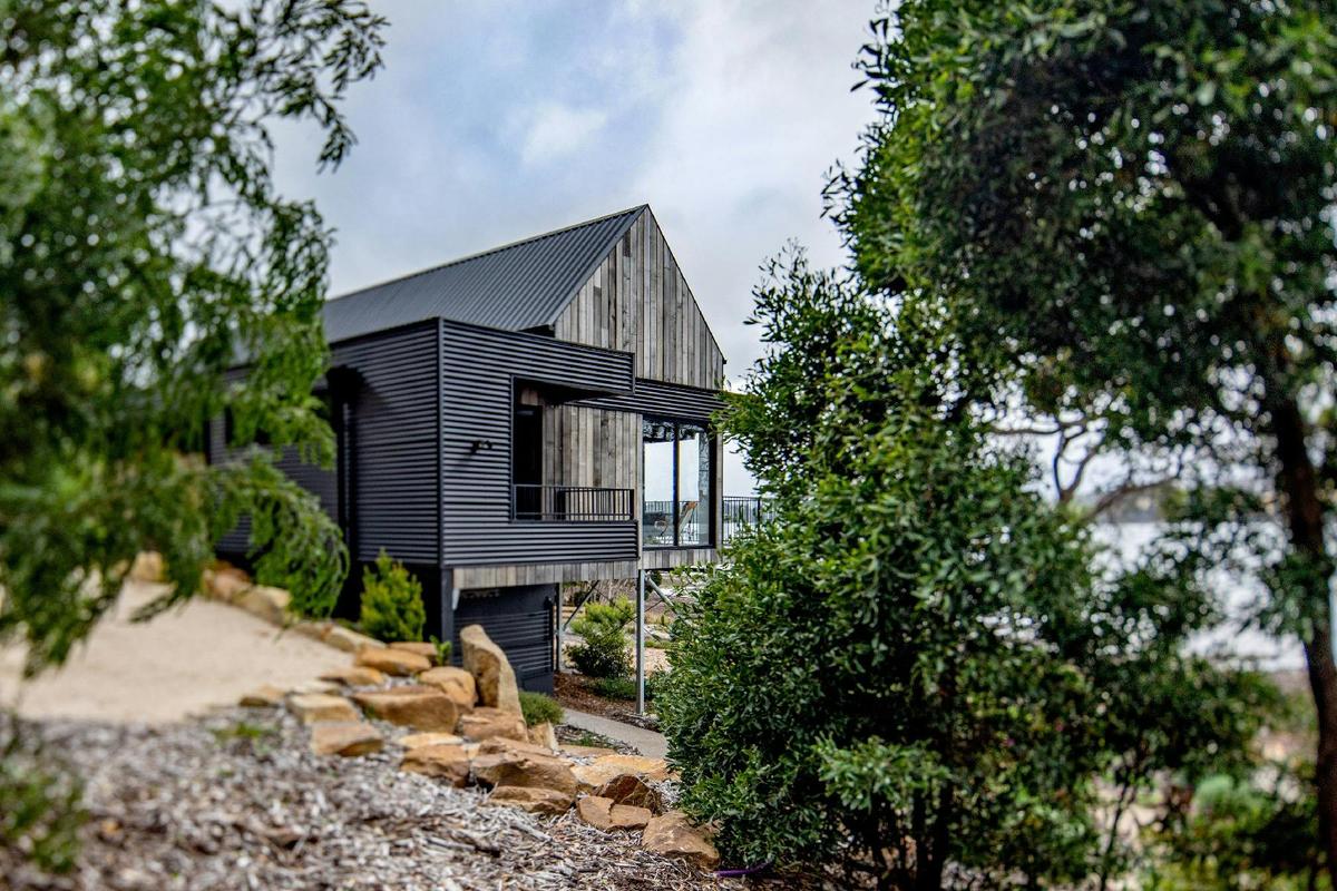 The fully landscaped gardens perfectly frame the cabin