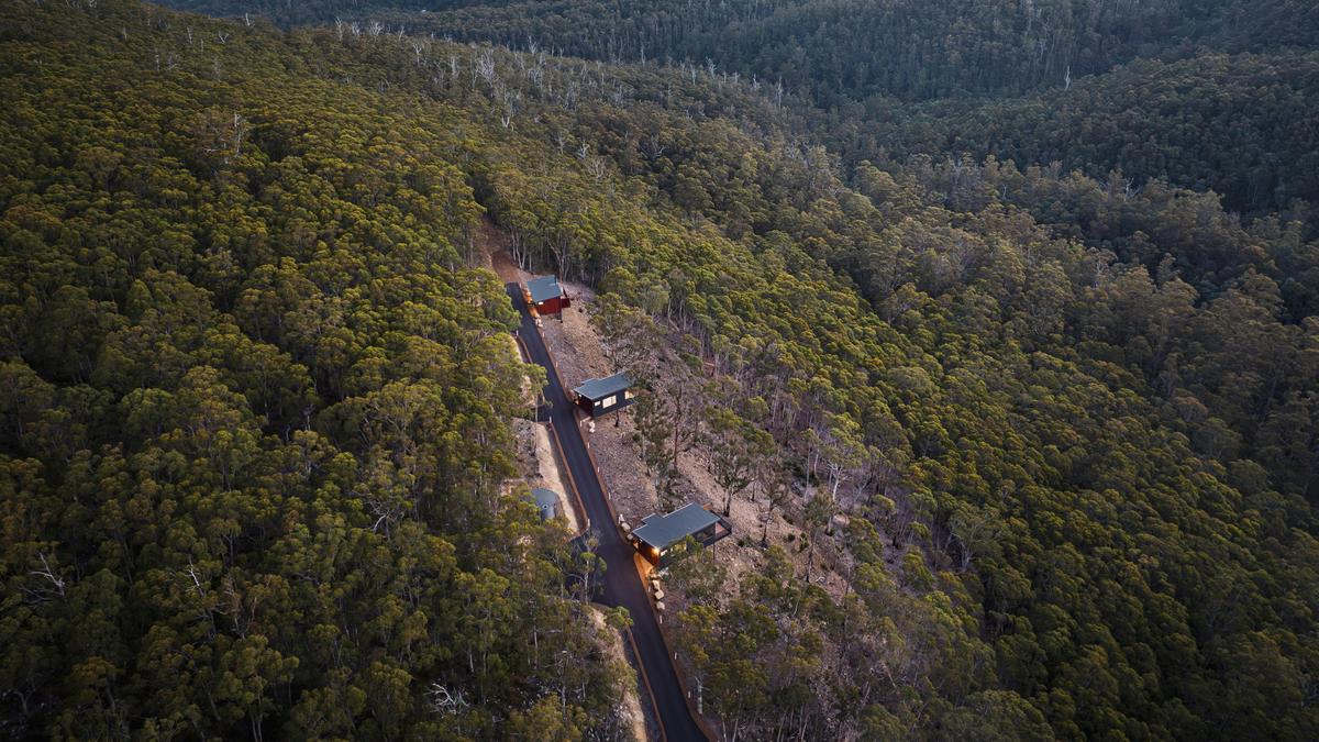 The Three Cabins Perched On The Hillside