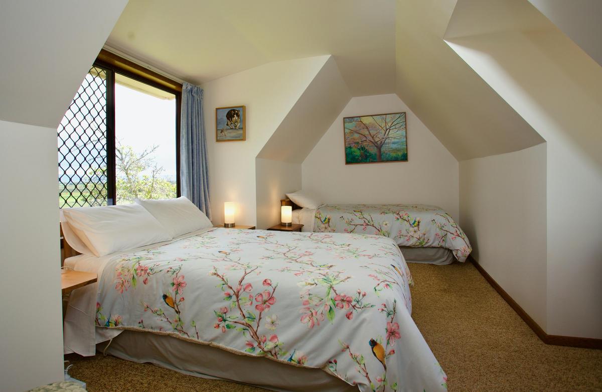 Unit 2 upstairs bedroom. Double and single beds.